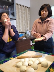 Above: Making dumplings with family